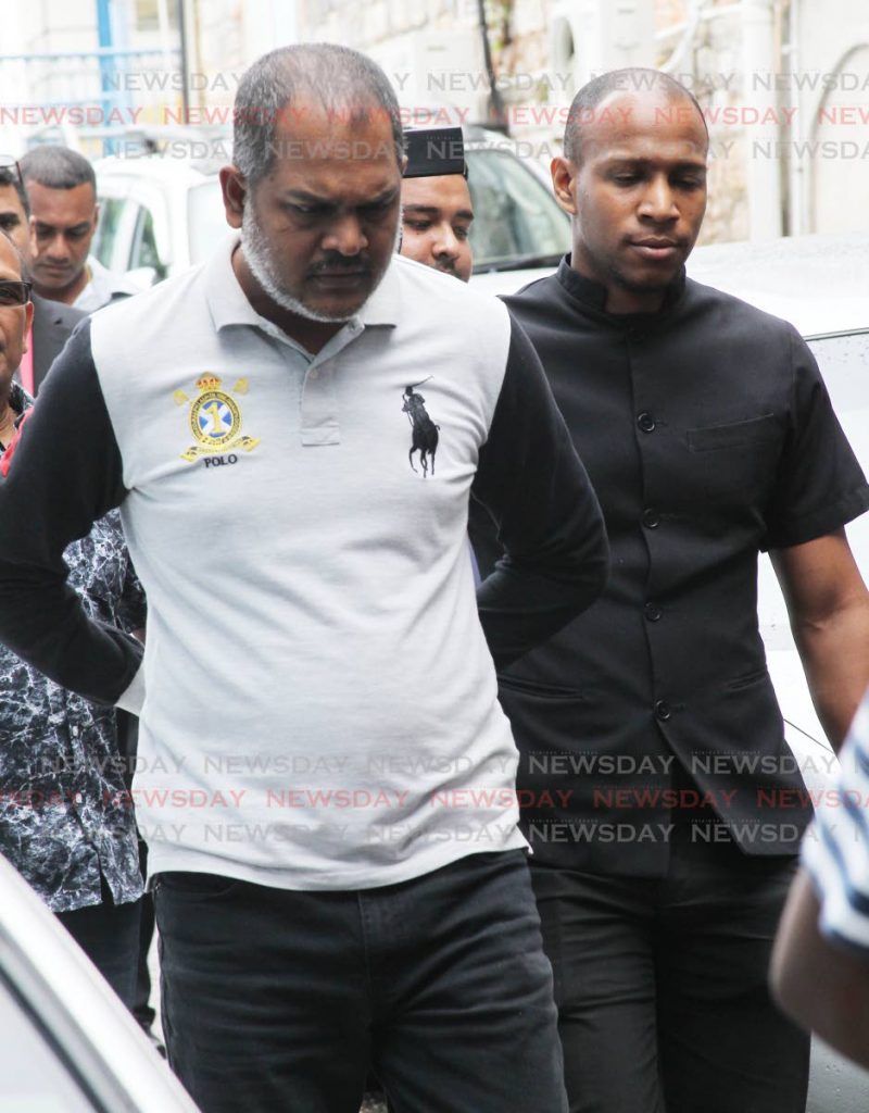PC Ian Dwarika assigned to the  La Romaine police station taken to the San Feranndo magistrate court charged with the kidnapping of Natalie Pollonais. Photo by Lincoln Holder.