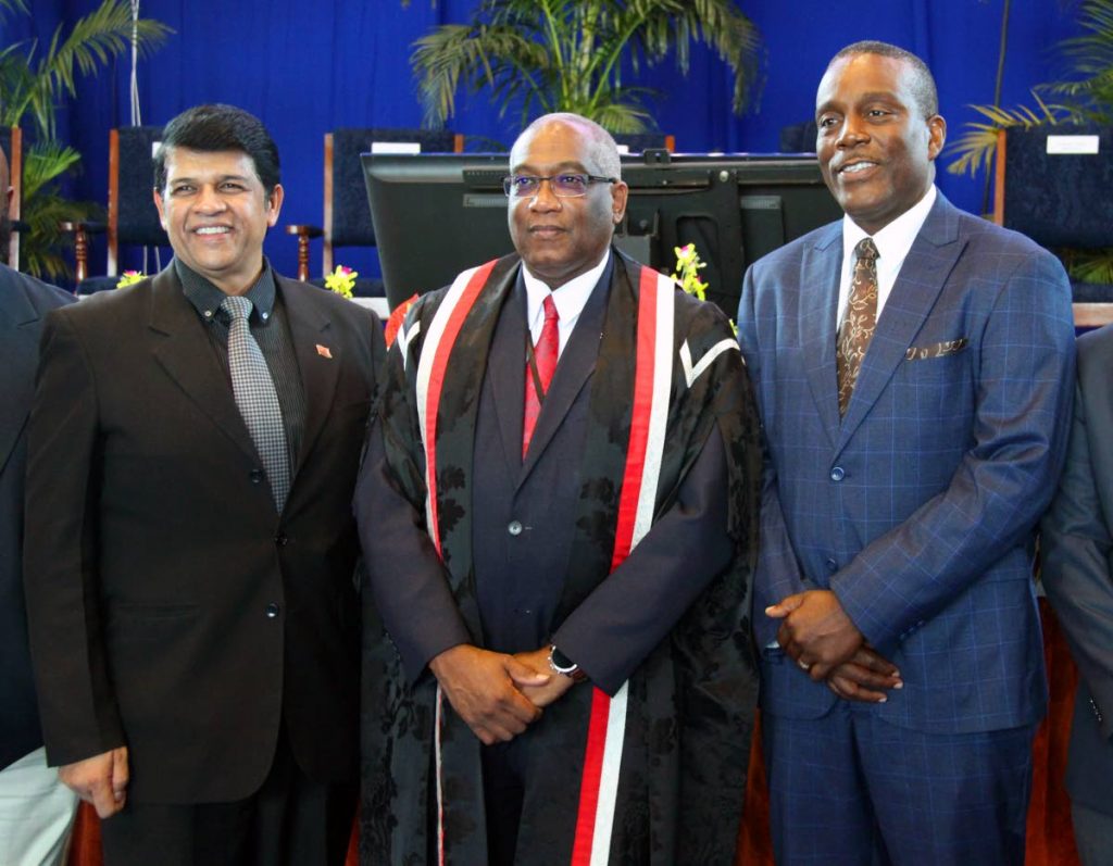 EDUCATED MEN: UWI St Augustine campus principal Prof Brian Copeland is flanked by St Augustine MP Prakash Ramadhar, left, and Tunapuna MP Esmond Forde at the UWI matriculation welcome ceremony Thursday evening at the campus. PHOTO BY SUREASH CHOLAI