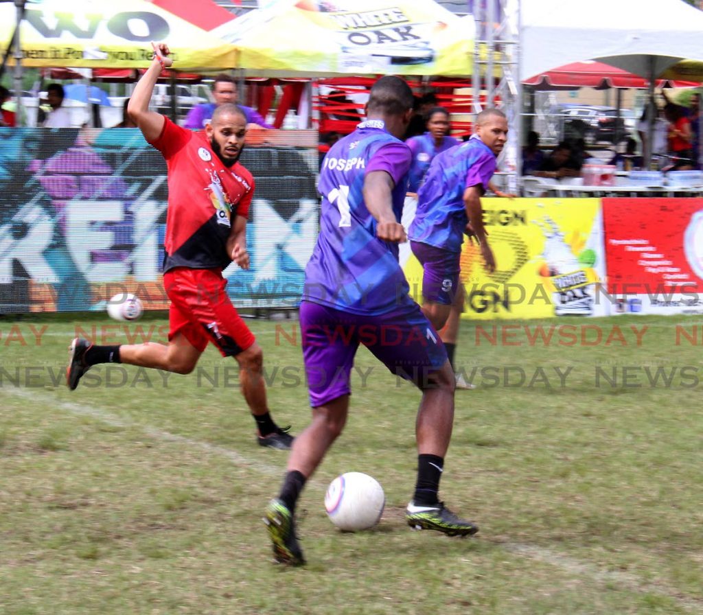 Team Fantasy's captain Travis Joseph on the attack against Red Ants at the Soccer 6 tournament held at the Hasely Crawford Stadium training field yesterday. PHOTO BY ROGER JACOB 
