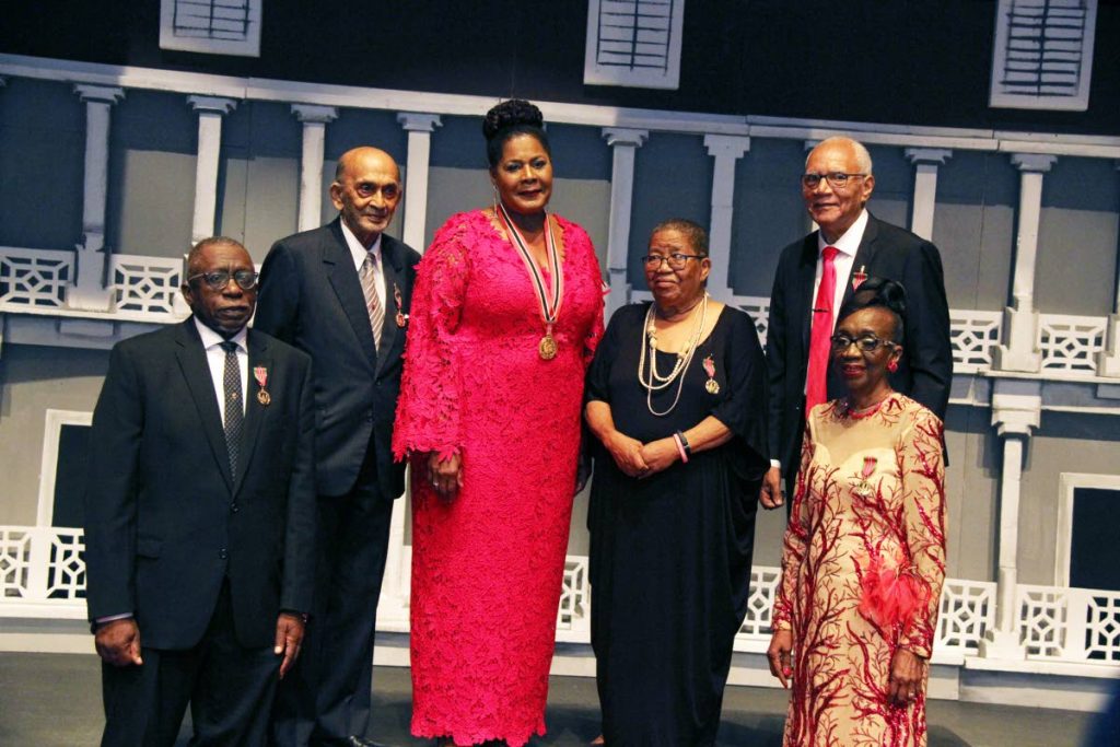 President Paula-Mae Weekes 3r from left pose with Chaconia Medal Gold recipients, from left Ewart Williams., Dr Romesh Mootoo, Dr Waveney Charles, Jones P Madeira and Joan Yuille Willlams at the National Awards Cermonylast night.  Photo by Sureash Cholai