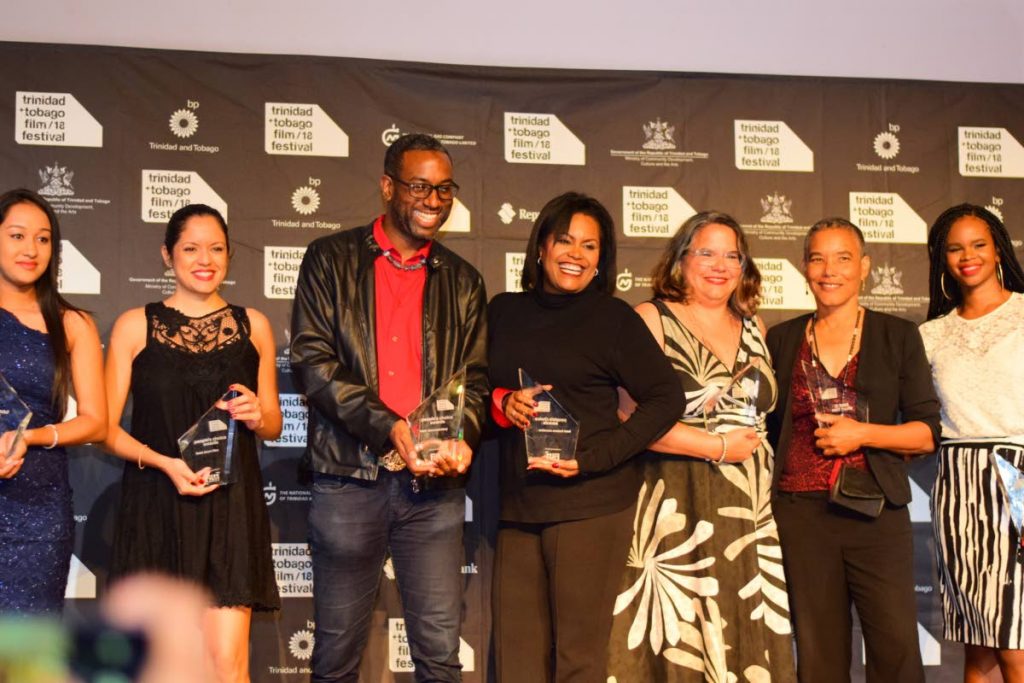 BIG WINNERS: Winners at the Trinidad and Tobago Film Festival 2018 Award Ceremony held at the Central Bank Auditorium on Tuesday Night. From left are Celine Dimsoy, best future critic, Mangroves director Teneille Newallo, Carnival Messiah director Ashley Karrell, Hero executive producer Lisa Wickham, Unfinished Sentences director Mariel Brown, Venus and Magnet director Elspeth Duncan and Caribbean Film Mart Best Pitch winner Kafi Kareem Farrell.