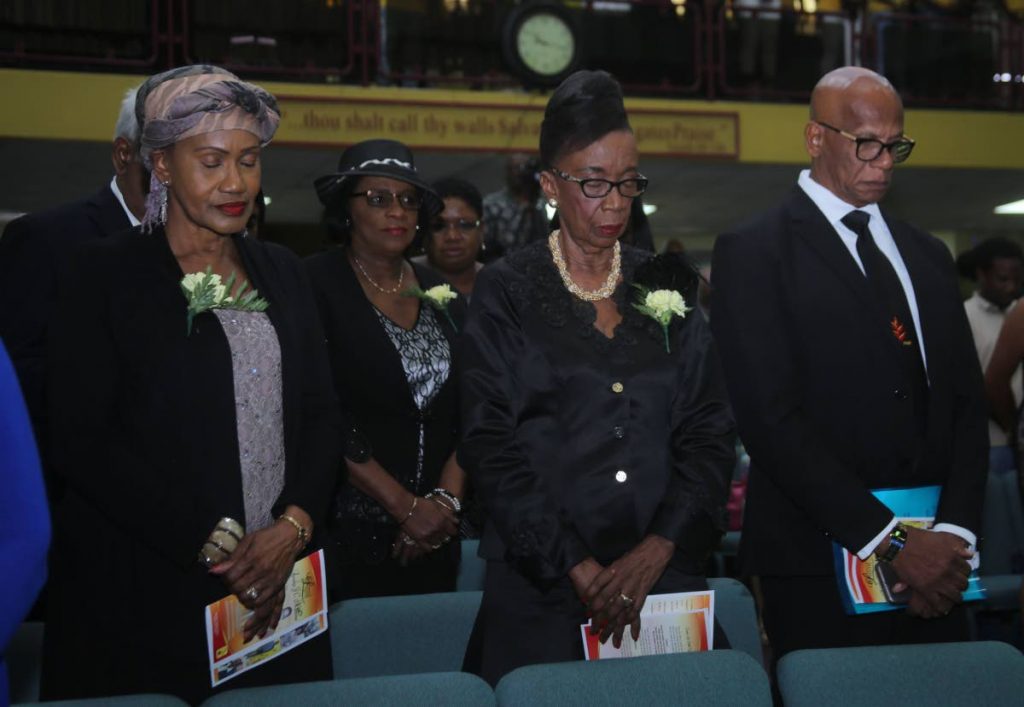 Labour Minister Jennifer Baptiste-Primus, former MP Marlene Coudray, 2nd from left, PNM vice chairman Joan Yuille-Williams and San Fernando Mayor Junia Regrello, right, at the funeral yesterday for trade unionist Ainsley Matthews.