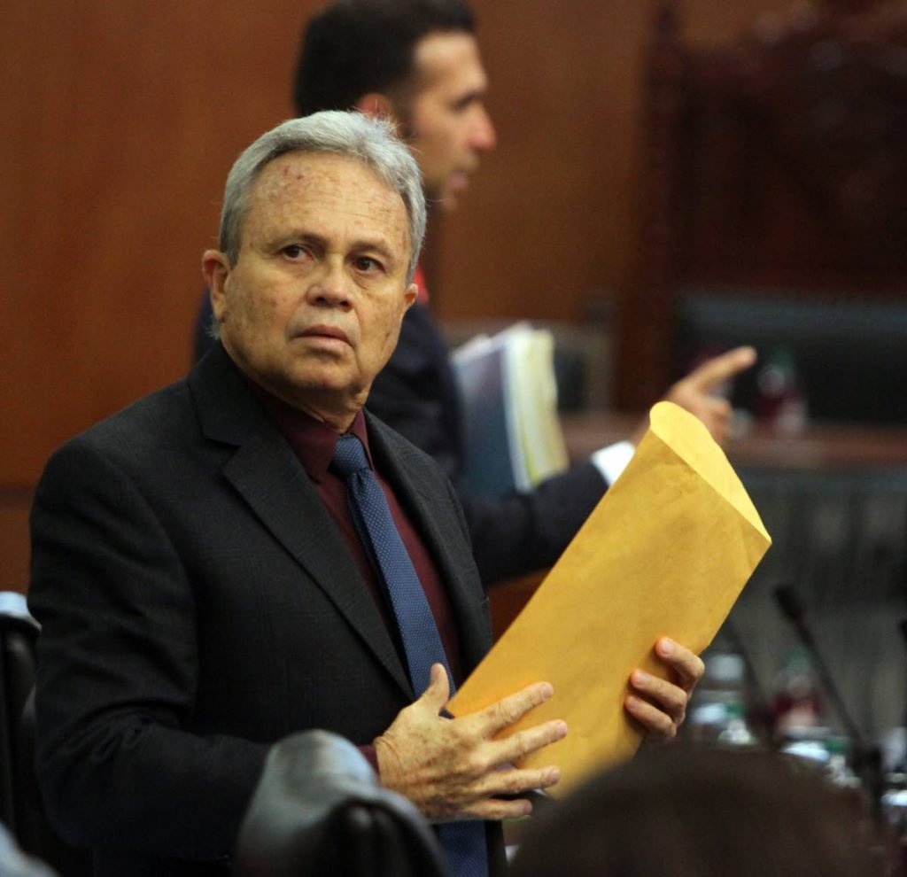 Finance Minister Colm Imbert armed with documents at the opening of Parliament last Friday. He will present the 2019 budget tomorrow. PHOTO BY SUREASH CHOLAI