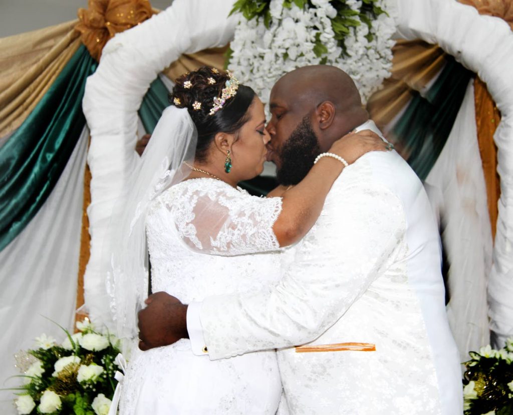 Andre Johnson and Ousha Boodai celebrate their love during their wedding at Trincity Mall.