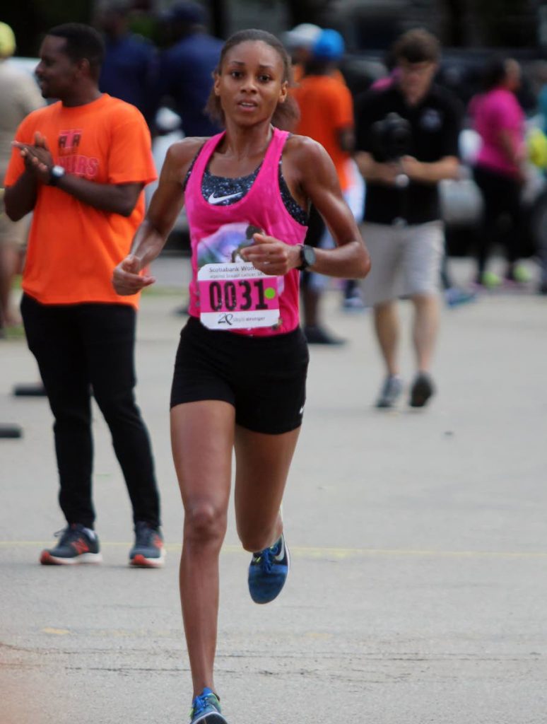 WINNER: Samantha Shukla looks to cross the finish line yesterday, at the 20th Scotiabank Women Against Breast Cancer 5K, in a time of 18 minutes, 15 seconds. The charity event took place around the Queen’s Park Savannah, Port of Spain.
