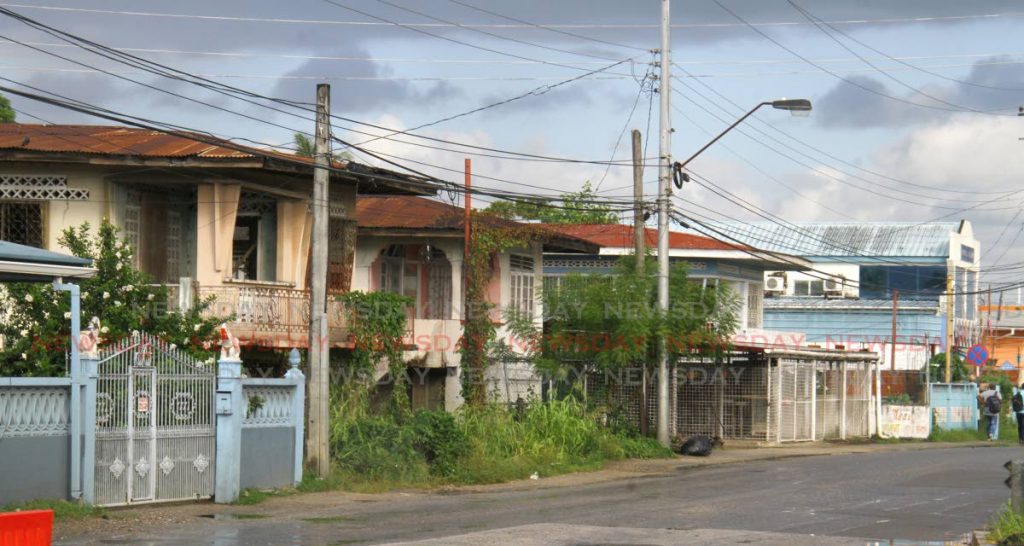 INTERCHANGE COMING: Some of the private properties earmarked for acqusition by the Ministry of Works, for the building of the intechange. Photo by Roger Jacob
