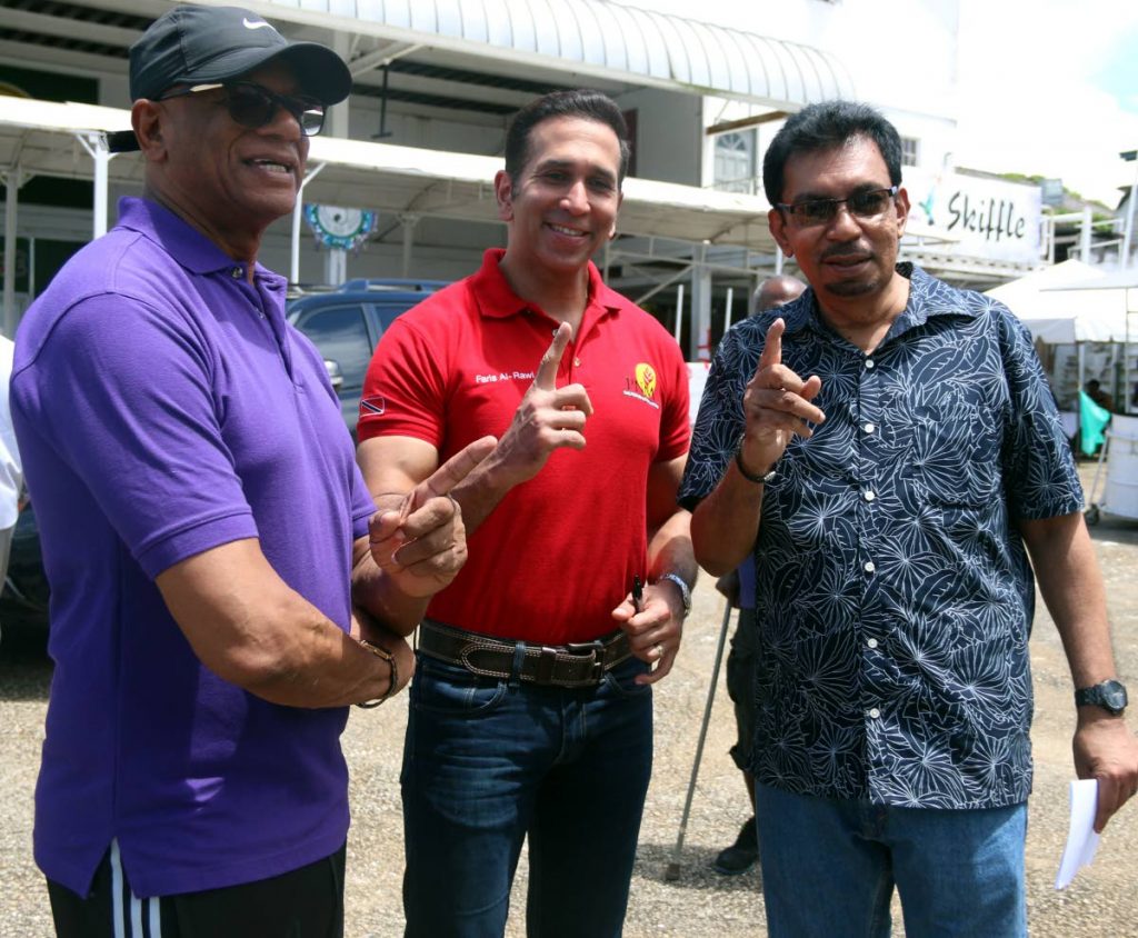 San Fernando mayor Junia Regrello, left, San Fernando West MP, Attorney General Faris Al Rawi and Local Government Minister Kazim Hosein, were confident of a win for Team Rowley after they voted at the Skiffle Bunch pan yard in San Fernando, yesterday.