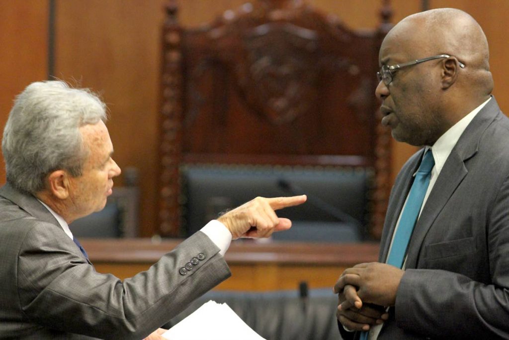 MY POINT IS: Finance Minister Colm Imbert speaks with THA Chief Secretary Kelvin Charles after Monday’s budget 
presentation in the House 
of Representatives.    PHOTO BY ROGER JACOB