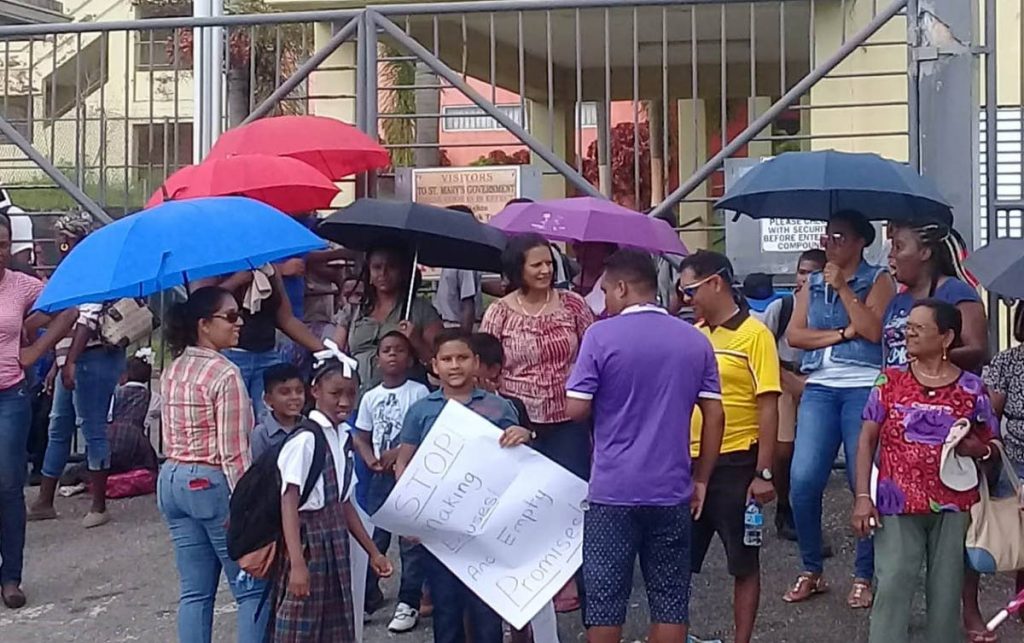 Parents and students of St Mary's Government Primary School protest over sewer problem which has forced the closure of the school.