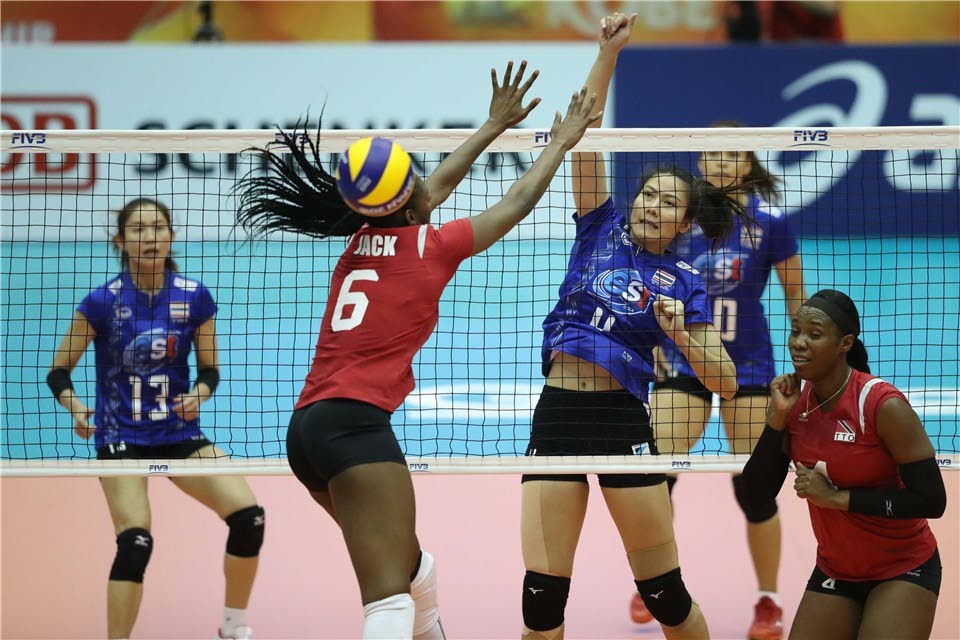 TT’s Sinead Jack attempts to block an effort from a Thailand player during their meeting at the FIVB Women’s Volleyball World Championships in Kobe, Japan, yesterday. Thailand won the match 3-1.