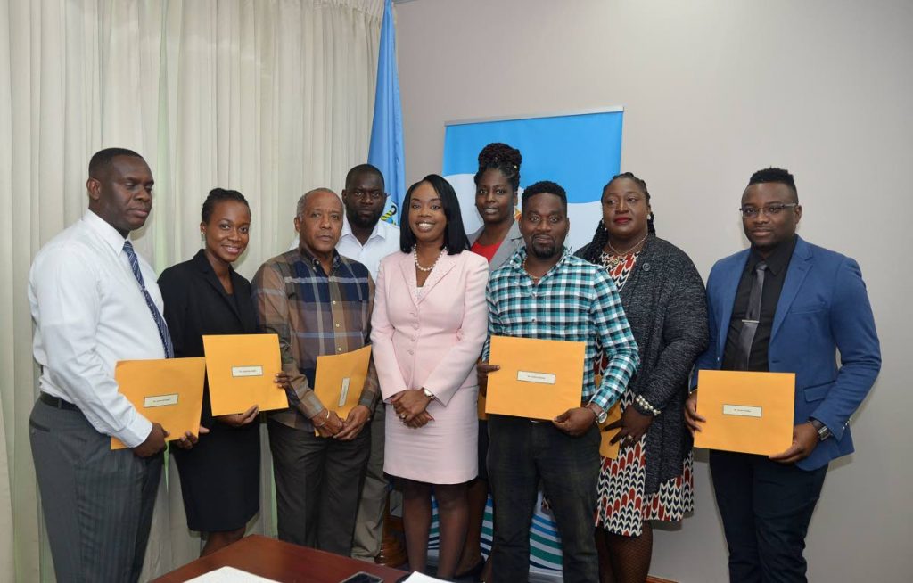 Tourism Secretary Nadine Stewart-Phillips, fifth from left, takes a photo with newly appointed members of the Board of the Pigeon Point/Store Bay beach facilities, from left, Kieron McDougall, Trudy Daly-Caraballo, Chairman Ronald Celestine, Deputy Chairman Ricardo Alfred, Esther Tobias-Clarke, Natisha Charles-Pantin, Delmond Edwards, and Kevern Phillips.
