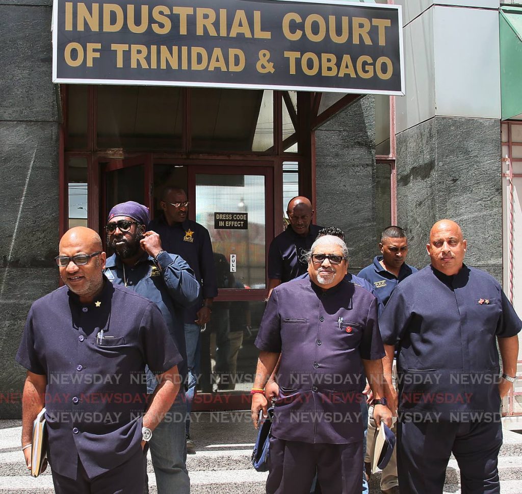 Left OWTU's Education officer and PRO Ozzie Warick and other members leave the Industrial Court.
PHOTO BY AZLAN MOHAMMED