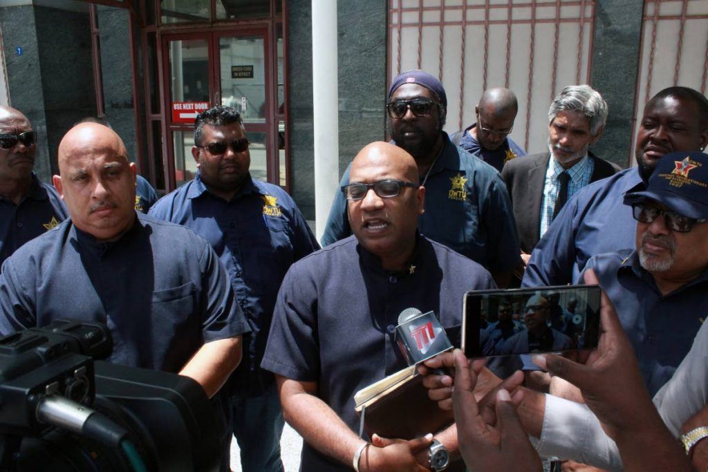 OIL MEN: Members of the OWTU speak with reporters outside the Industrial Court in Port of Spain yesterday.   PHOTO BY ENRIQUE ASSOON