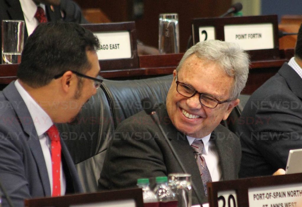 Finance Minister Colm Imbert enjoys a joke with National Security Minister Stuart Young during the 2019 budget debate on Friday. PHOTO BY ROGER JACOB