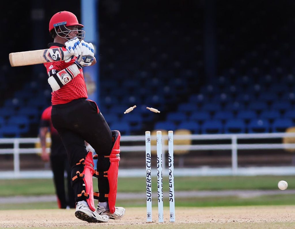 Canada’s opener Bhavindu Adhihetty is bowled by TT red Force’s Rayad Emrit inn their CWI Super50 match, on sunday, at the Queen’s Park Oval, St Clair. Red Force won by two wickets.