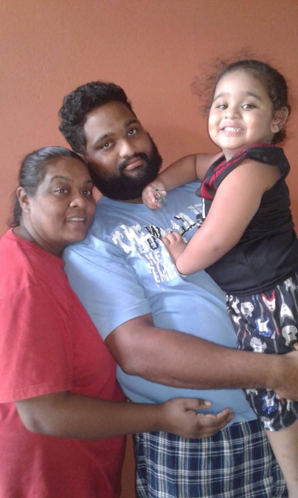QUESTIONS: Savita Basdeo-Lochan and her husband Jerome Bernard with their two-year-old son Justin.