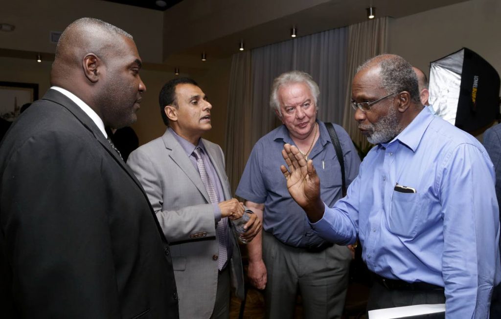 In this April 2, 2017 photo, Claude Benoit, right, makes a point as Minister of Works and Transportation Rohan Sinanan, second from left, listens along with then president of the Tobago Chamber Demi-John Cruickshank, left, and president of the Tobago Hoteliers and Tourism Association (THTA) Chris James at a  stakeholders meeting at the Mt. Irvine Bay Resort to discuss the impending departure of the Superfast Galicia cargo ferry from the inter-island route.