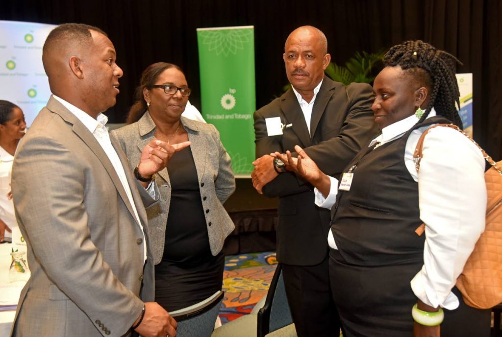 Members of the All-Tobago Fisher Folk Association discuss the success of the Sustainable Fisheries Management Workshop with Ronda Francis (second from left), Corporate Responsibility Manager, BPTT and Joel Primus (left), Corporate Sustainability and Stakeholder Relations Advisor, BPTT.


