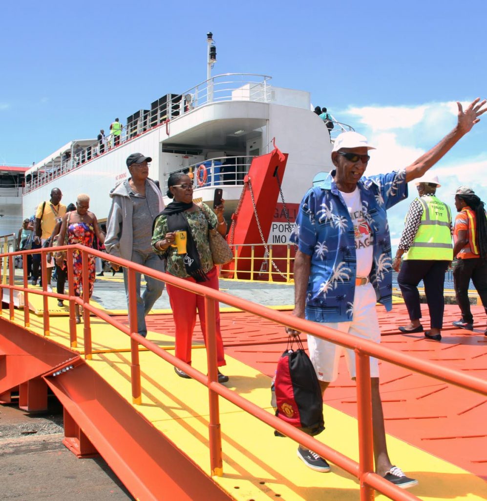 WE REACH: Passenegers disembark from the MV Galleons Passage in Scarborough, Tobago after the vessel arrived on its maiden commercial voyage from Port of Spain earlier this month.