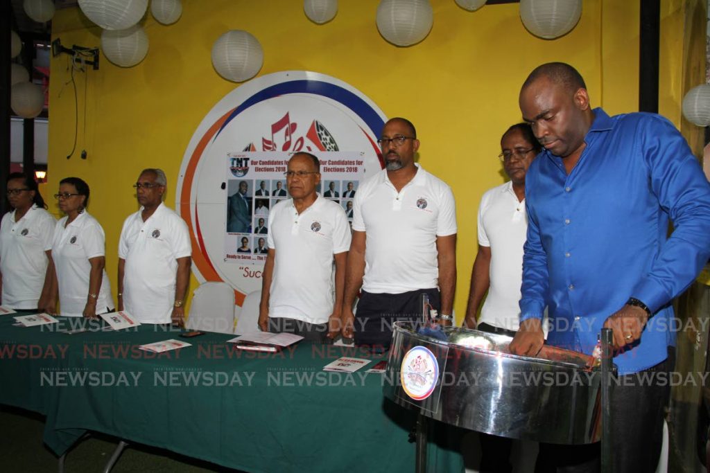 Former Port of Spain mayor Keron Valentine plays the national anthem as members of his slate Team New Times stand at attention at Newtown Playboyz panyard, Woodbrook last Thursday. Valentine is seeking election as Pan Trinbago president on October 28. PHOTO BY SUREASH CHOLAI