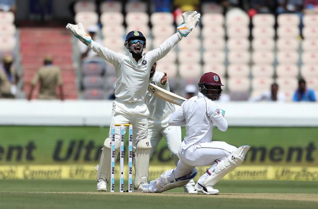Indian wicketkeeper Rishabh Pant successfully appeals for the dismissal of West Indies’ player Shimron Hetmyer, bowled by Kuldeep Yadav, during the first day of the second cricket Test match between India and West Indies in Hyderabad, India, on Friday. India won the Test series 2-0.