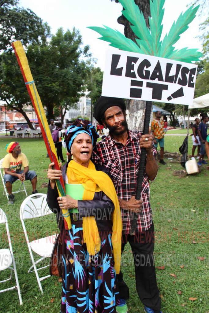 WEED POWER: Theodora Uleria (Auntie Tia) and Claude Jeffers join the call legalise the use of marijuana during the  All Mansions of Rastafari’s  National Cannabis Rally at Woodford Square in Port of Sapin wihich attracted hundreds of people.