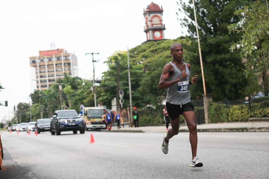 Veteran runner Curtis Cox takes part in the RBC Race for Kids, around the Queen’s Park Savannah, Port of Spain on October 7. Cox placed first in the 15K in 51 mintues 16 seconds.