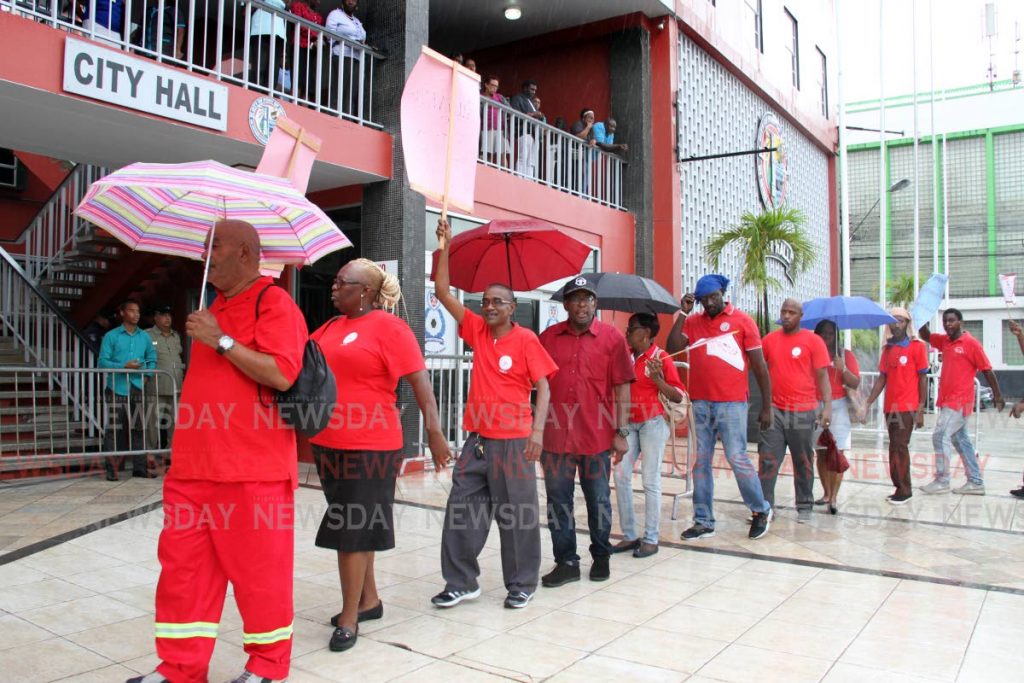 Port of Spain City Corporation workers represented by the Amalgamated Workers Union (AWU)  protested outside City Hall against the delays in salaries negotiations and for better working conditions. PHOTO  by SUREASH CHOLAI