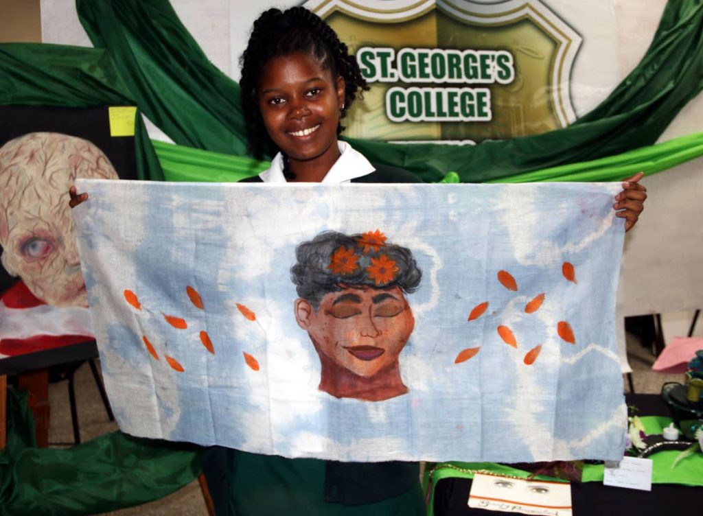 Acacia Le Matre-Joseph of St  George’s College in Barataria shows off her art work at SanFest in San Fernando on October 17.