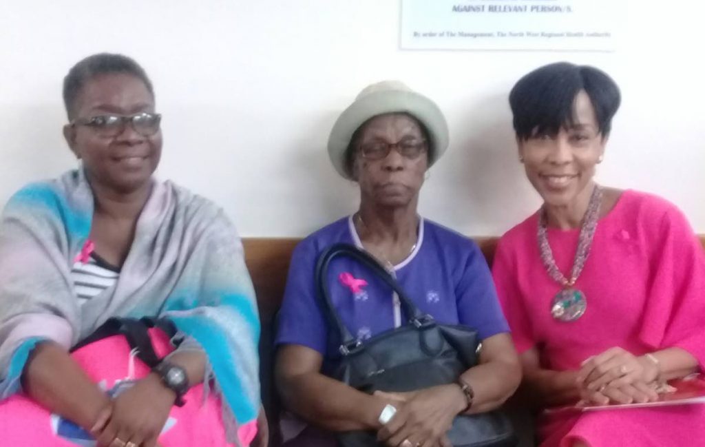 SHARON AND PATIENTS: Jennifer Cornelius-Dick and Theresa Jordon sit with wife of the prime minister, Sharon Rowley at Heroes for Cancer event held at the Breast Cancer Clinic,  National Radiotherapy Centre, St James, yesterday. Photo by Marlene Augustine
