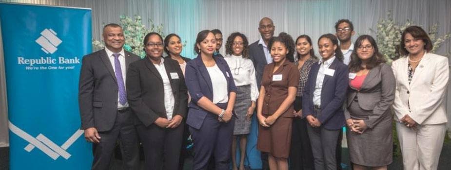 Ready to work: Republic Bank executive director, Roopnarine Oumade-Singh, far left; motivational speaker Don La Foucade, seventh from left; and general manager, human resources, Anna-María García-Brooks, far right, with the first batch of graduate interns.