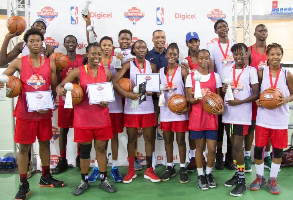 The 14 winners of the NBA Experience and head coach of the New Orleans Pelicans Alvin Gentry, are all smiles after the Elite Camp in TT, recently.