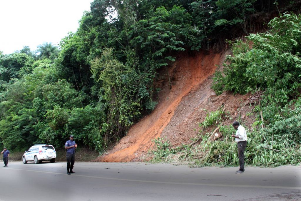 Severals landslides along the Lady Young Road forced it's closure for most of the morning period as crews from different Ministries clear the roadway from mud and fallen trees, later in the evening it was open to one lane traffic. PHOTO SUREASH CHOLAI