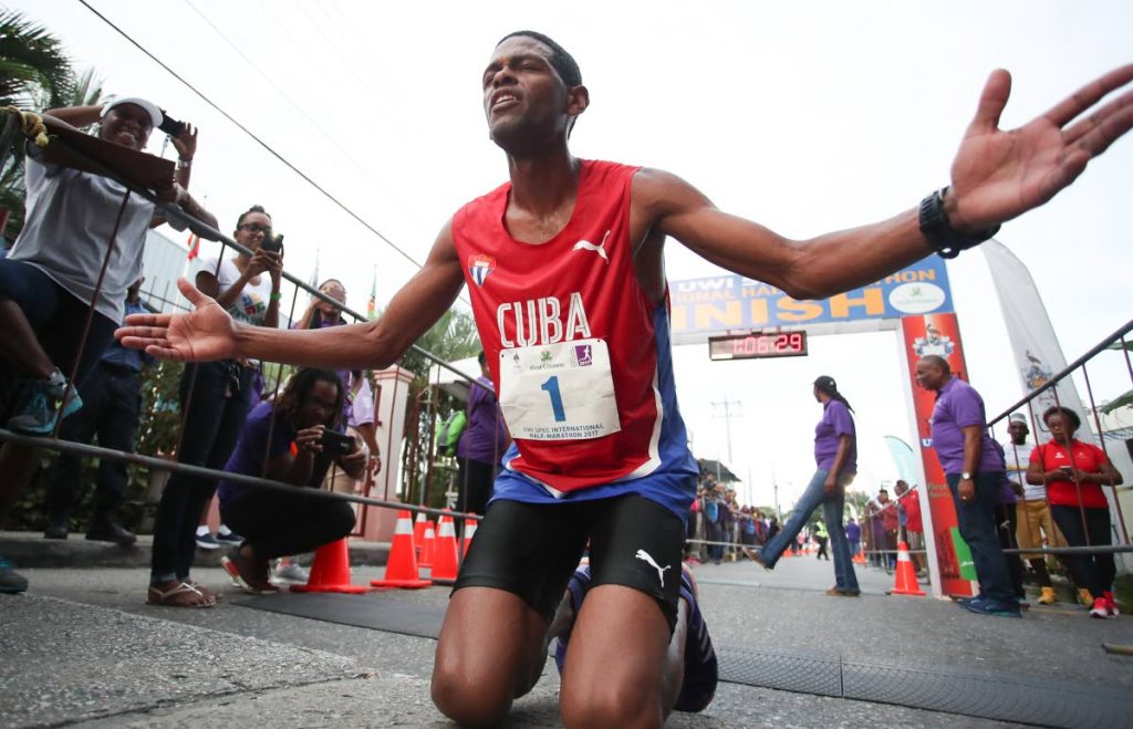 In this file photo, Cuba’s Richer Perez reacts after crossing the finish line in 1st place with a new record time of 1:06.22, during the 2017 Edition of the UWI SPEC International Half Marathon at UWI SPEC, St. Augustine.