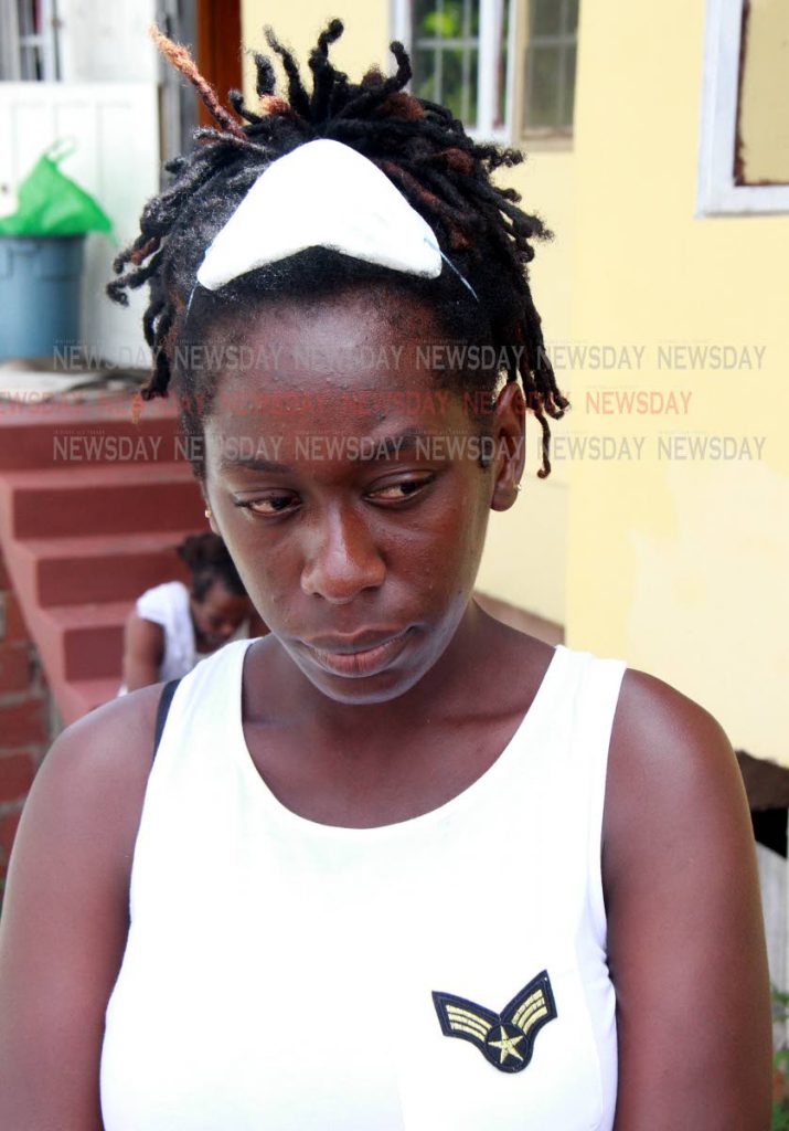 A sad Tammy Ross, 26 after there family home at Gasparillo was partially destroyed by fire.
PHOTO BY ANIL RAMPERSAD.