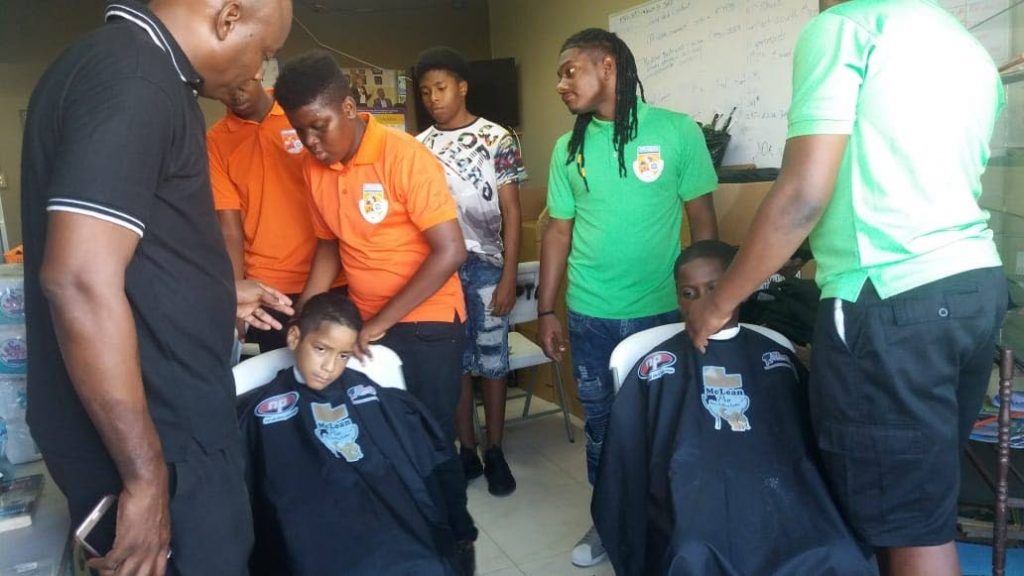 Barbers of the Professional Barbering School visited Oropune Gardens, Piarco, to offer free haircuts to flood-affected victims. 
