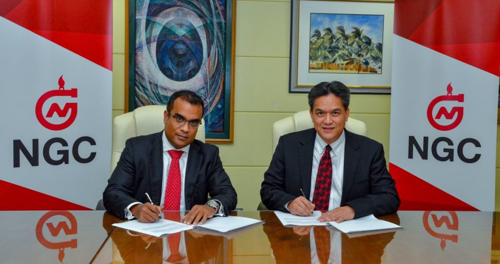 NGC president Mark Loquan and DeNovo founder and CEO Joel Pemberton sign the Block 1(a) gas sales agreement at NGC’s head office, Point Lisas on August 29. PHOTO COURTESY NGC.