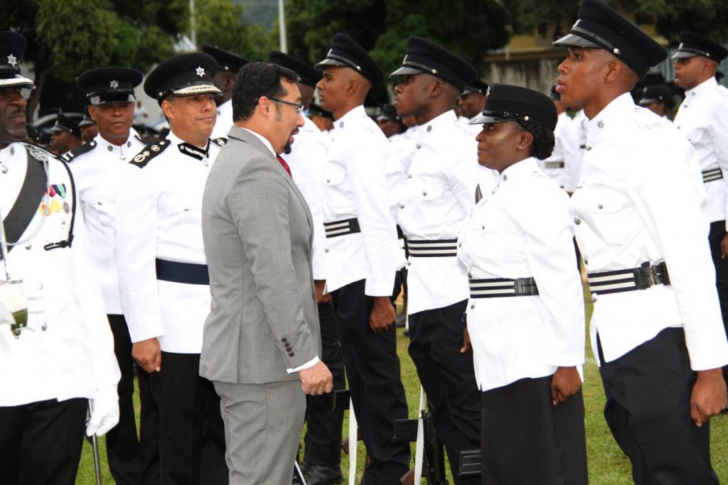 National Security Minister Stuart Young inspects the police service passing out parade at the Police Academy in St James. PHOTO BY SUREASH CHOLAI