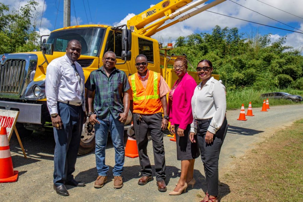 LIGHT IT UP: (From left) Secretary of the Division of Public Utilities, Assemblyman Clarence Jacob; Secretary of the Division of Food Production, Forestry and Fisheries, Assemblyman Hayden Spencer; T&TEC Commissioner Senior Supervisor Striesand Murray; administrator of the Division of Settlements, Urban Renewal and Public Utilities Cherry-Ann Edwards-Louis, and Public Utilities Programme Coordinator of the Division of Public Utilities Dalia Jerry, at a street lighting project in Cow Farm Road, Goldsborough, Tuesday.
