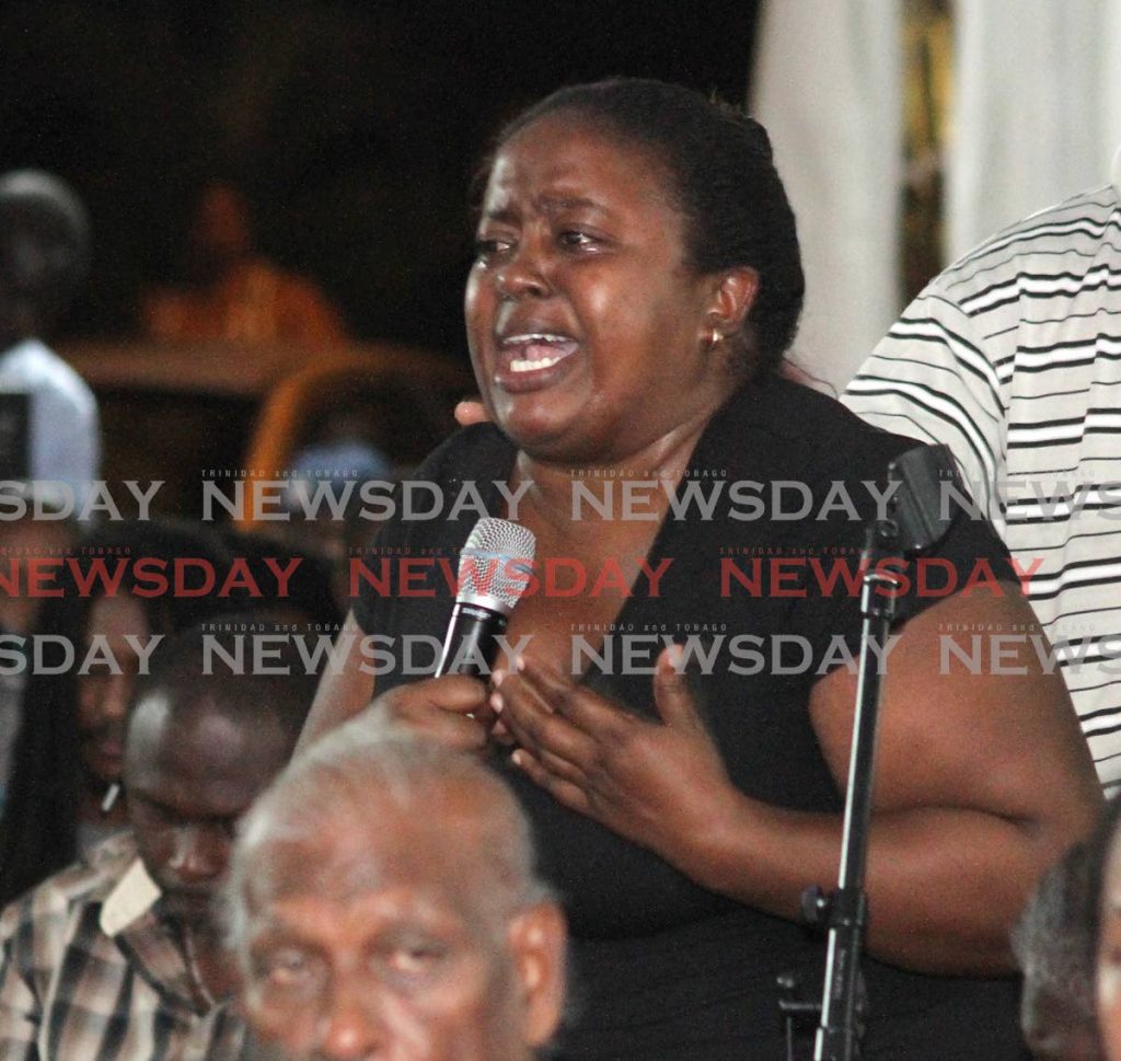 File photo: A resident gives an emotional account about her losses from flooding during a community meeting at Greenvale Park, La Horquetta on November 1. 

PHOTO BY ROGER JACOB