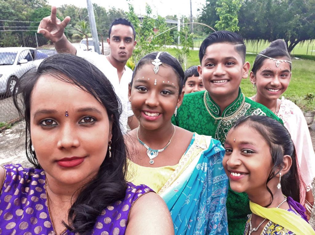 These students of St. Julien Presbyterian School are all smiles as the pose for a photo during the school’s Divali celebrations.