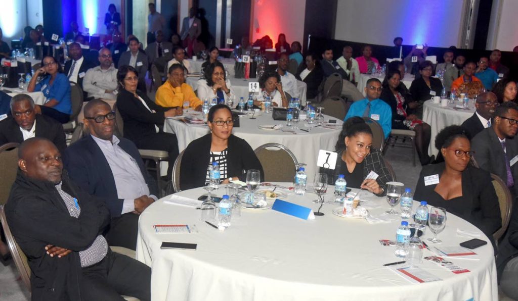 Cross-section of ICT professionals listen to a presentation at iGovTT’s ICT Business Symposium at the Hyatt Regency, recently.

