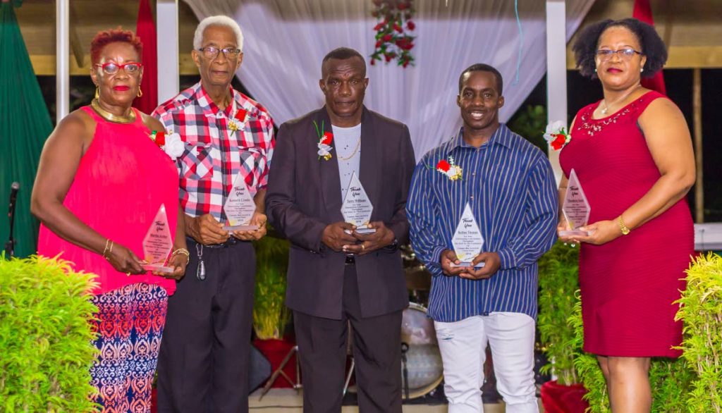 PROUD BUNCH: (From left) Marther Archer, Kennett Crooks, Terry Williams, Kerton Thomas and Theodora Scott received awards as sport educators at the Canaan/Bon Accord community awards. 