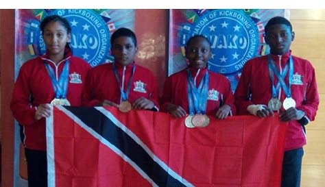 Shakira Sandy (left) and her TT teammates Noah Sorillo (second from left), Kurell Quamina (second from right) and Kace Mitchell.