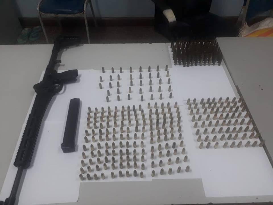 A Kel-Tec Sub 2000 machine gun and assorted ammunition  found in the possesion of three Venezuelans in Cedros on Friday. PHOTO COURTESY TTPS