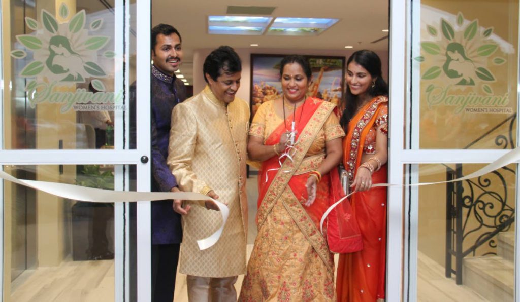 Dr. Prakashbhan Persad and his wife, Sashtri cut the ribbon to officially open the Sanjivani Women's Hospital, assisted by their children, Dr Vashisht Persad and Dr Gyotti Persad.