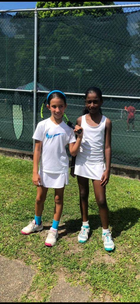 Brianna Harricharran, right, won the Girls U10 singles final, at the Methanol Holdings (Trinidad) Ltd Junior Tennis Tournament, after beating Shiloh Walker,left, 1-4,5-3,(10-5).