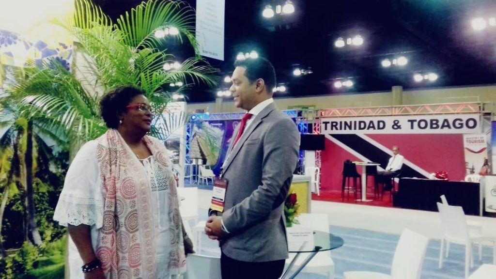 Tourism Minister Randall Mitchell and Barbados Prime Minister Mia Mottley speak at the FCCA Trade Show in Puerto Rico. Photo courtesy Ministry of Tourism.