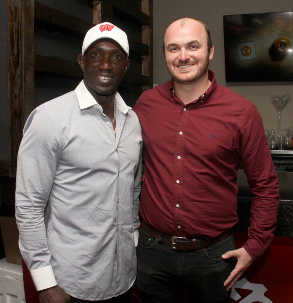 Former Manchester United player, TT’s Dwight Yorke and  Chivas Regal Global Communications manager, Graeme Gardiner, at the launch of the partnership between Manchester United and Chivas Regal, on Tuesday evening,  at Residence Lounge, One Woodbrook Place, Woodbrook.