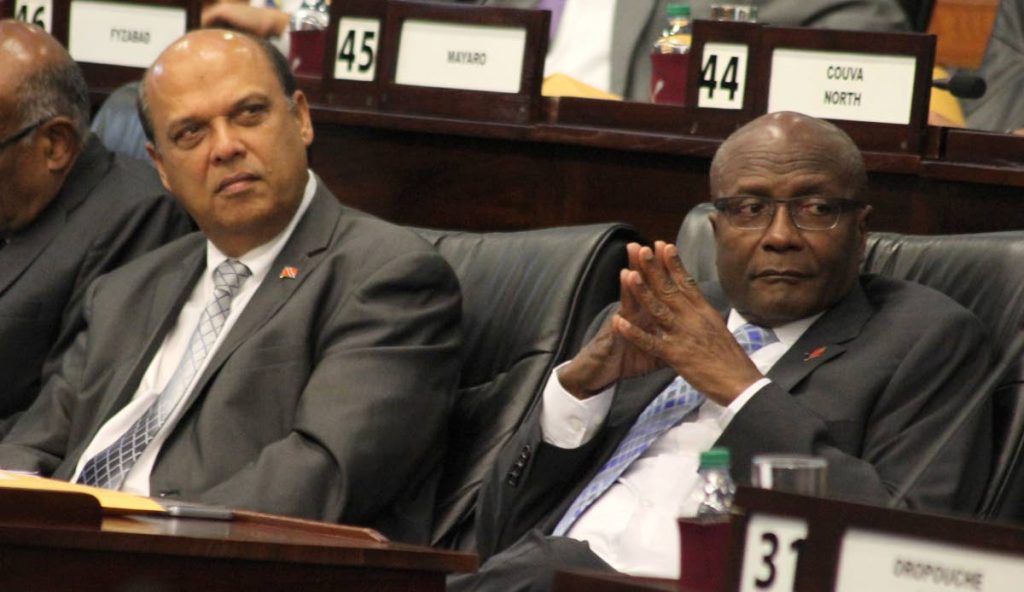 Chaguanas East MP Fazal Karim, left, and Naparima MP Rodney Charles in the Lower House on November 14. In the House on Friday, Charles posed a question on the demolition of homes in Santa Flora. PHOTO BY ROGER JACOB